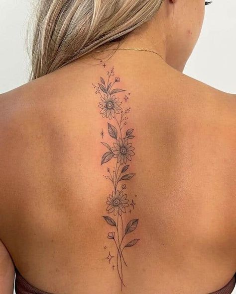 20 Unique And Meaningful Back Tattoos For Women Meaningful Back Tattoos, Back Tattoos For Women, Feminine Back Tattoos, Floral Back Tattoos, Flower Spine Tattoos, Tattoos For Women Flowers, Petite Tattoos, Spine Tattoos For Women, Stylist Tattoos