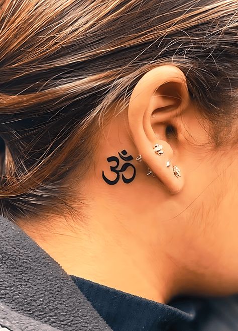 Om Neck Tattoos Women, Om Tattoo Behind Ear, Tattoo Ideas Om, Om Tattoo Ideas, Aum Tattoo, Buddhism Tattoo, Om Symbol Tattoo, Om Tattoo Design, Hand And Finger Tattoos