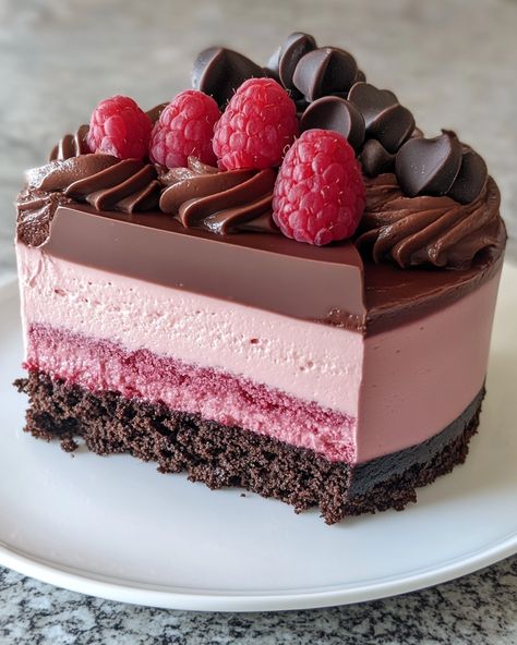 "I was a bit nervous to try this Chocolate Raspberry Mousse Cake, but let me tell you—it's a showstopper! One bite and my friends couldn't stop raving about it.   Ingredients:  - 1 cup dark chocolate, chopped - 2 cups raspberries - 1 cup heavy cream  For the full list of ingredients and detailed instructions, check the link in the first comment [👇] [👇].  Imagine a rich, velvety mousse hugging fresh, tart raspberries. This cake is pure bliss! Perfect for parties or a special treat at home. You won’t regret giving it a try.  #ChocolateLovers #RaspberryDelight #DessertGoals #MousseCake #BakingFun" Raspberry Mousse Cake Filling, Lemon Raspberry Mousse Cake, Raspberry Mouse For Cake, White Chocolate Raspberry Mousse Cake, Chocolate Raspberry Mousse Cake Recipe, Chocolate Raspberry Mousse, Chocolate Raspberry Mousse Cake, Raspberry Mousse Cake, My Recipe Book