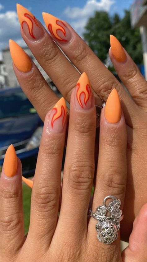 Orange flame nails Orange Flames Nails, Orange Flame Acrylic Nails, Summer Flame Nails, Flame Nails Orange, Orange Flame Nail Designs, Fire Nails Orange, Fire Inspired Nails, Download Festival Nails, Black Flame Nail Art