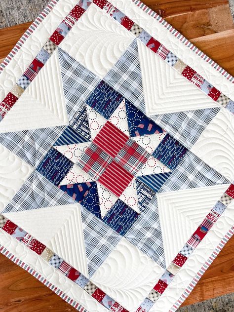 From Utah Shop Hop 2023, our original exclusive pattern is now available online! Make your very own Scrappy Star Mini Quilt from all your leftover scraps or your favorite line of fabric. This project is made of half-square triangles making it a cinch to put together. The scrappy border creates a classic yet modern feel for this mini quilt. Finished size: 25" x 25"  #scrappystar #4thofjuly #tabletopper #4ofjulydecor #decorations #sewing #quilt #miniquilt #quilting #pattern Red White And Blue Carpenter Star Quilt, Table Quilt, Quilts On Point, Half Square Quilt Patterns, Friendship Star Quilt, Star Quilt Pattern, Quilting Blocks, Quilts Of Valor Patterns Free Easy, 12 Inch Quilt Block Patterns Free