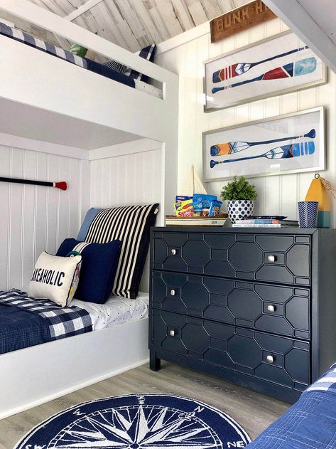 A navy blue dresser sits next to white bunkbeds. Bunk Houses, Boys Nautical Bedroom, Nautical Interior Design, Nautical Decor Bedroom, Cottage Remodel, Lake House Bedroom, Blue And White Decor, Camper Reno, Nautical Interior