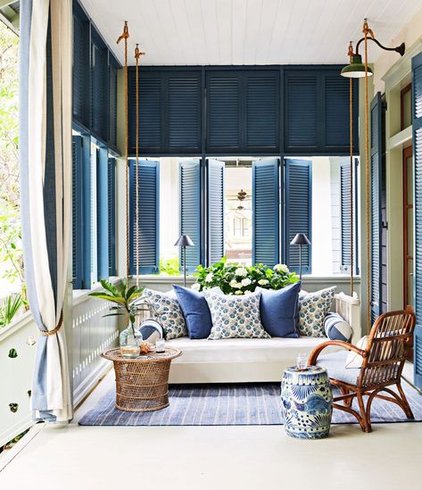 In the hands of Birmingham designer Heather Chadduck Hillegas, an outdated former rental in Watercolor, Florida, got a timeless transformation into a gorgeous beach haven. #floridahome #coastalhome #southernhome #homedesign #interiordesign Front Porch Curtains, Sherrill Furniture, Adaptive Design, Coastal Architecture, Porch Styles, Porch Curtains, Flat Roman Shade, Front Porch Design, Sunrooms