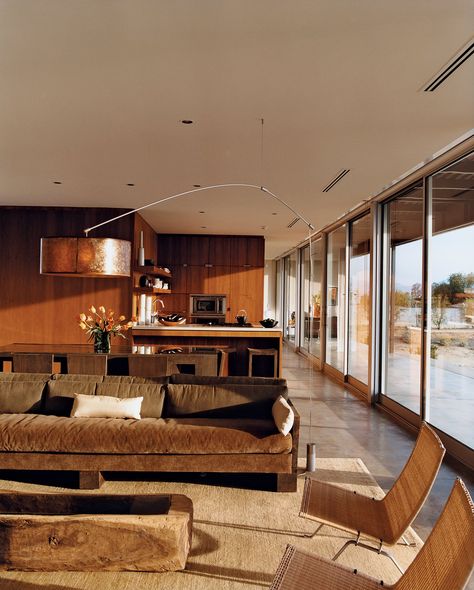 The open living and dining plan is flooded with natural light. The wicker PK22 lounge chairs are by Poul Kjaerholm for Fritz Hansen. The suspension lamp is by DePadova. Tagged: Living Room. Photo 1 of 6751 in Best Photos from Desert Utopia Marmol Radziner, 70s House, 70s Interior, Desert House, Retro Interior Design, 70s Home, Casa Country, Mid Century Modern Interiors, Boho Interior