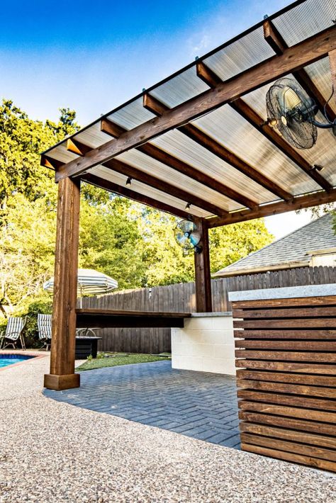 Free standing modern wood pergola with a bronze Hercules system covering it. Pergola With Transparent Roof, Sky Poly Pergola, Contemporary Pergola Designs, Transparent Roofing Ideas, Modern Wood Pergola, Pergola With Clear Roof, Pergola Shade Ideas, Cabana Pergola, Glass Awning