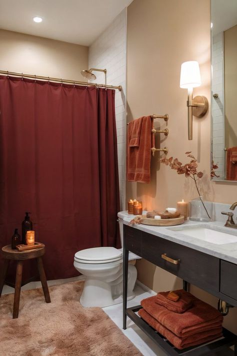 Modern luxury bathroom with sleek accents and a large vase of fall flowers as the main fall decor. Maroon Bathroom Decor, Rust Orange Bathroom, Maroon Bathroom, Autumn Bathroom Decor, Red Bathrooms, Autumn Bathroom, Aesthetic Bathroom Decor, Fall Bathroom Decor Ideas, Red Bathroom Decor