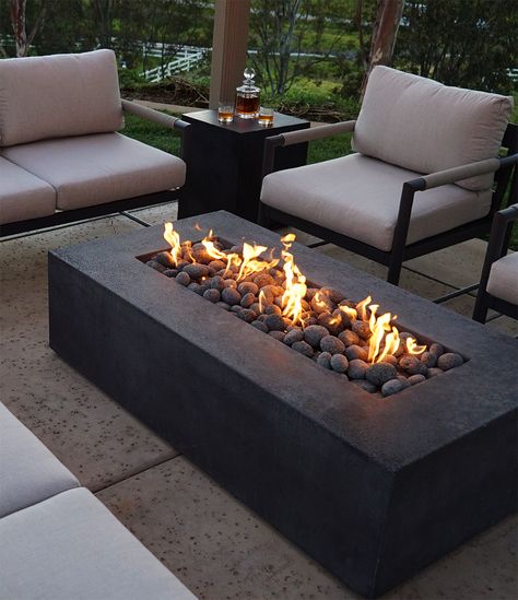 7 Reasons Why a Fire Pit is the Perfect Addition to Your Summer Evenings(and Other Occasions too) 🌃🔥Article out now | #starfire #starfiredirect #gasfirepits #outdoorliving #patiodesign #landscapingdesign #QualityMaterials #backyarddesign #backyardinspo #outdoorlivinginspo #summervibes #summer #summernights #outdoorspaces #summerentertainment Gas Fire Pit Ideas Backyard, Fire Pit Balcony, Square Fire Pit Ideas, Modern Outdoor Fire Pit, Black Fire Pit, Garden Ideas Patio, Modern Outdoor Firepit, Luxury Fire Pit, Rectangular Gas Fire Pit