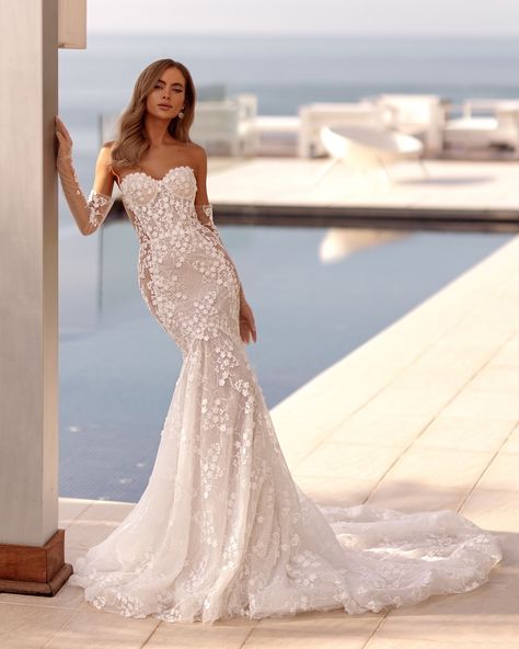 This ultra-feminine Tina Valerdi mermaid wedding dress features a sweetheart corset bodice with illusion panels on sides bathed in delicate floral lace placements detailing allover with a dramatic train. Latest Wedding Gowns, Corset Wedding Dress, Embroidered Corset, Lace Motifs, Best Wedding Guest Dresses, Aesthetic Candles, Wedding Dresses Corset, Corset Bodice, Luxury Wedding Dress