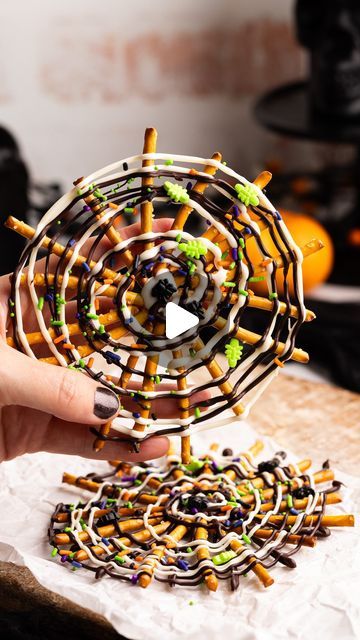 Sophia Assunta | Cute Treats and Party Recipes on Instagram: "These  viral pretzel spiderwebs are super easy to make! All you need is pretzel sticks, melted chocolate, and Halloween sprinkles!  They’re a super cute way to celebrate the spooky season 👻

You can find the full tutorial on my website, or comment ‘tutorial’ for the link sent to your DMs.

Happy snacking, and be sure to follow for 31 days of Halloween, with a new fun spooky treat every day of October 😱🎃

#halloween #halloweentreats #pretzels #halloweenpartyfood #halloweendessert #chocolatecoveredpretzels #spiderwebpretzels" Pretzel Spiderwebs, Halloween Sprinkles, Pretzel Sticks, Spooky Treats, October Halloween, 31 Days Of Halloween, Melted Chocolate, Chocolate Covered Pretzels, Party Recipes