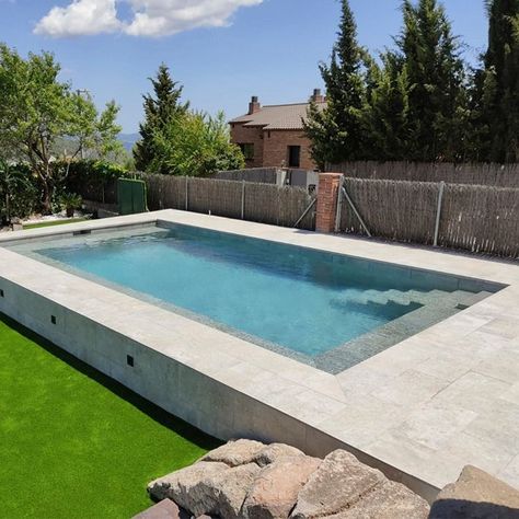 Choosing gray for your pool tank is a smart move. And combining two different shades of gray is even better!!! Like this project sent to us by Flakolete, it is beautiful. It is a Skimmer model with a built-in bench, steps and platform built by Newest Traditions using our colors Mistery Grey & Mistery Blue Stone. Congratulations!!! Light Grey Pool, Pool Skimmer, Pool Colors, Grey Tiles, Built In Bench, Shades Of Gray, Pool Tile, Urban Environment, Grey Marble