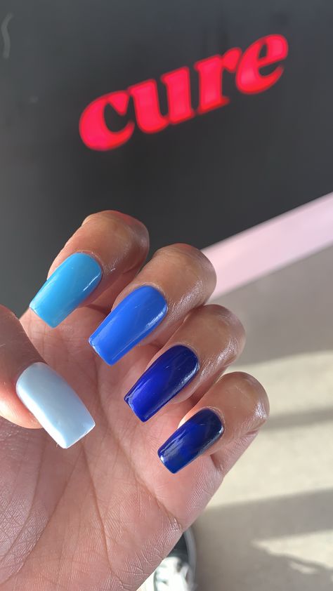 Blue gradient ombré acrylic nails. Different color nails colored Blue Ombre Nails With Design, Plan Color Nails, Blue Multicolor Nails, Different Blue Nails, 5 Different Color Nails, Color Fade Nails, Ombré Blue Nails, Blue Fade Nails, Color Gradient Nails