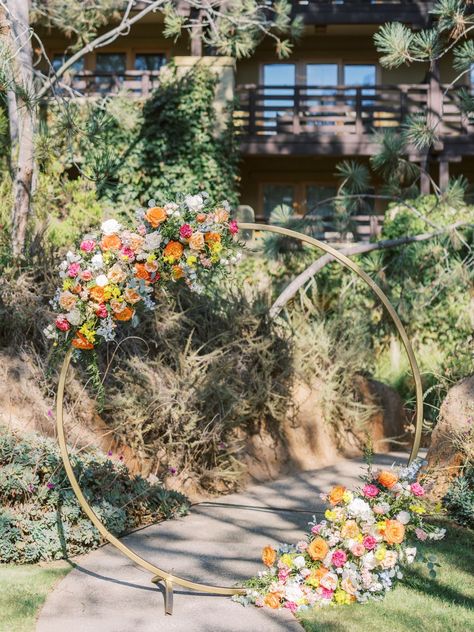 Circular Floral Arrangements, Garden Ceremony Wedding, Ranunculus Orange, Circular Wedding Arch, Tropical Disco, Wisteria Garland, Wedding Arch Floral, Golden Arch, Rose Ideas