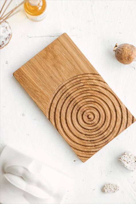 This is a beautiful wooden rectangular tray with a water ripple design design. It is a perfect addition for a modern minimalist style home adding a calming effect to the interior. The tray is decorative and can hold some of the key design items like small vases, sculptures, home scents and candles, creating a cosy atmosphere. The board is made out of hardwood oak and then covered with a layer of beeswax for durability. Gifting Business, Minimalist Style Home, Restaurant Table Design, Candle Board, Wood Napkin Holder, Small Vases, Modern Minimalist Style, Tray Design, Water Ripples