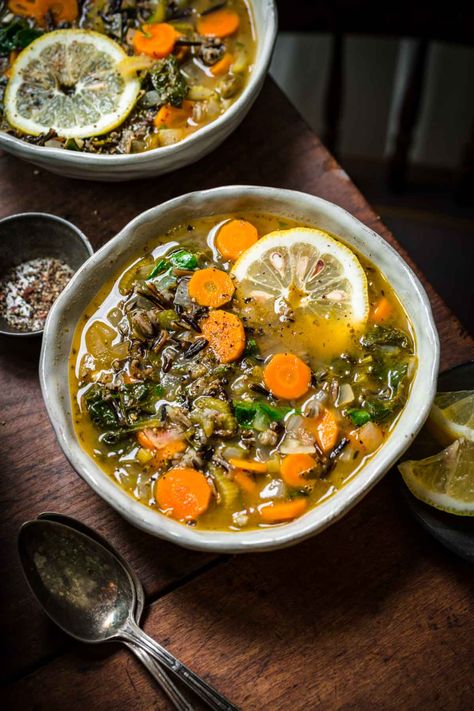 This vegan wild rice soup is packed with vegetables, herbs and bright lemon juice for a super easy and flavorful soup. Thanks to the richness of wild rice, this is the perfect soup to enjoy on a cold winter or fall evening. It's also great for meal prep and can be customized with your favorite protein for a well-rounded meal. Vegan Wild Rice Soup, Vegan Wild Rice, Gf Soups, French Lentil Soup, Rice Lemon, Kale Vegetable, Crowded Kitchen, Lemon Soup, Cooking Wild Rice