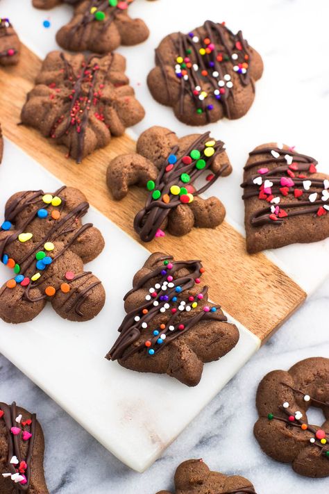 Chocolate spritz cookies are fun and festive! These easily shaped cookies are made in a flash using a cookie press, and can be decorated any way you please. These cookies freeze well! Chocolate Spritz Cookies, Spritz Cookie Press, Cookie Press Recipes, Spritz Cookie, Spritz Cookie Recipe, Christmas Yummies, Creative Recipes, Spritz Cookies, Shaped Cookies