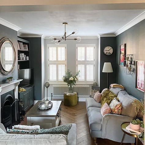 We adore this lounge with herringbone floor in an Edwardian home. The walls are dark which keeps the room snug looking. The period features have been restored including the fireplace and cornicing. In the home of @roseontherow on Instagram. Edwardian Living Room, Edwardian Home, Victorian House Interiors, Feature Wall Living Room, Snug Room, Victorian Living Room, Narrow Living Room, Dark Living Rooms, Park Street