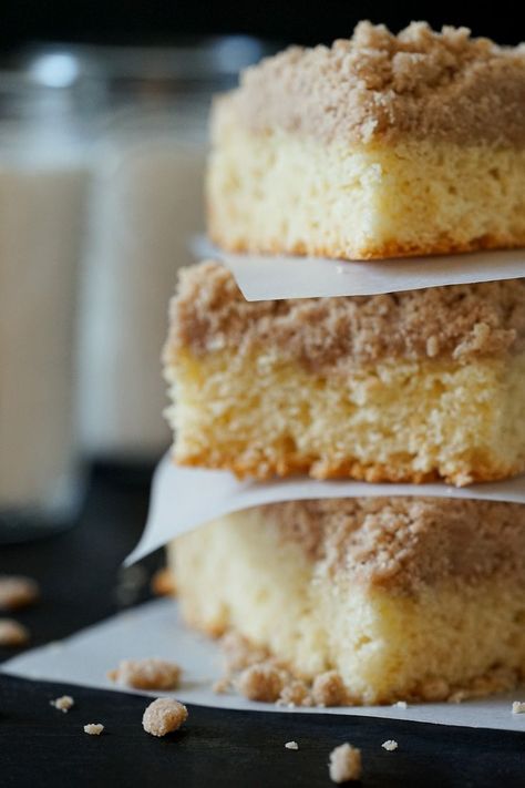 Three stacked slices of German crumb cake on parchment paper. German Crumb Cake Recipe, German Coffee Cake, Crumb Cake Recipe, Fluffy Light, Cake Base, Good Coffee, Scrumptious Desserts, Crumb Cake, Crumb Topping