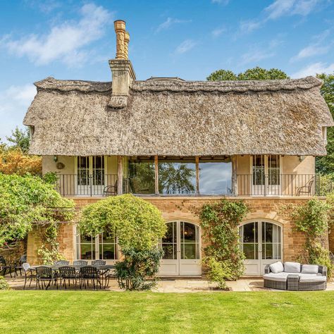 Pembroke Cottage — originally built as the gate lodge to Pembroke Lodge — presents a unique opportunity to own a piece of British heritage. 

Sat within Pembroke Lodge inside Richmond Park, residents can enjoy contemporary comfort surrounded by the natural beauty of one of London's largest green spaces. Pembroke Lodge, Richmond London, Fairytale Houses, Large Hallway, Woodland Cottage, Thatched House, Copper Tub, Chandelier Kitchen, Inglenook Fireplace