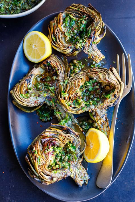 Grilled artichokes are deliciously tender and smoky. Skip the butter and aioli and serve them up Italian style with our punchy Italian Salsa Verde. A tasty vegan appetizer or side dish that presents beautifully! Italian Salsa, Grilled Tandoori Chicken, Feasting At Home, Vegan Appetizer, Grilled Artichoke, Lamb Kebabs, Artichoke Pasta, Grilled Tofu, Italian Sauce