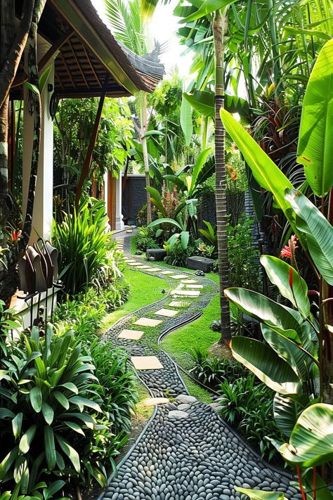 A beautifully arranged Bali-inspired backyard pathway with green foliage and smooth stepping stones. Pathway Designs Landscape, Bali Garden Ideas, Bali Inspired Garden, Bali Garden Design, Bali Garden Ideas Backyards, Bali Inspired Backyard, Bali Style Garden, Bali Landscape Tropical Gardens, Hanging Garden Bali