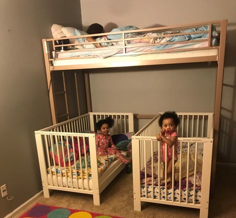 Needless to say we have a lot of kids (5 in total) so we are always trying to save space wherever we can. My husband and I recently decided to merge all the girls together in one room so we needed a way to fit all the beds in there. We purchased a metal loft bunk bed from Walmart, which sits up higher than a normal bunk bed. We then went to IKEA and bought two convertible cribs for our little ladies. The cribs fit perfectly underneath and still have a walk way for the two year old to get out. Bunk Beds With Crib Under, Loft Bed Crib Underneath, 3 Cribs In One Room Ideas, Crib And Bunkbed Shared Room, Bunk Beds And Crib Shared Room, Crib Under Loft Bed, Crib Under Bunk Bed, Two Under Two Bedroom, Loft Bed With Crib Underneath