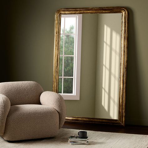 A true classic, the Antiqued French Louis Floor Mirror from Four Hands brings a timeless touch of refinement home with its art deco-inspired design. Its aged-gold leaf finish - reminiscent of antique finds - adds an elegant, vintage look to any room, for a true statement piece that exudes sophistication. Highlights Full length mirror easily leans against any wall Rectangular frame suits a variety of spaces Available in Antiqued Gold Leaf frame color Four Hands Antiqued French Louis Floor Mirror in Gold Hallway Nook, Bedroom Upgrades, Hudson Furniture, Full Length Mirror Wall, Copper Decor, Interior Design Resources, Antique Mirrors, Minimalist Apartment, Contemporary Mirror