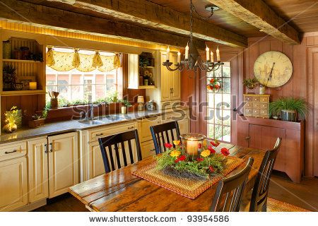 stock photo : An image of a sitting room and fireplace in a primitive colonial style reproduction home.  The home is built with materials reclaimed from structures built in the late 1700's. Colonial Kitchens, Colonial Kitchen, Primitive Bathrooms, Rustic Country Kitchens, Comfortable Kitchen, House Restoration, Primitive Homes, Primitive Kitchen, Antique Kitchen