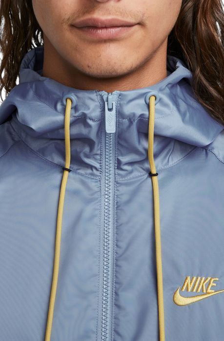 The Nike Sportswear Windrunner Jacket updates our first running windbreaker with lightweight fabric made from recycled materials. Design details pulled from the original version provide a heritage Nike look. This product is made with 100% recycled polyester fibers. Clean Look and Construction This versatile zip-up is made with 100% recycled polyester fibers. Its mesh lining, rib finishes and drawcords are all made from recycled polyester. Heritage Nike Design The iconic chevron design lines at the chest and contrast details honor the heritage look of the original Windrunner. Windrunner's Next Chapter A woven label sewn into the lining tells the Windrunner story. More Details Standard fit for a relaxed, easy feel Grommets made with Nike Grind rubber 100% polyester Machine wash Imported Running Windbreaker, Nike Looks, Windrunner Jacket, Nike Design, Band Design, Chevron Design, Woven Label, Next Chapter, Nike Sportswear