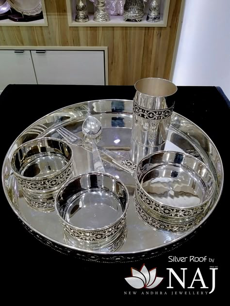 Antique Dinner Set...Call or Whatsapp us on 9032041323 or email to mynaj@najindia.com... Available Only @ Naj Jewellery, Nellore. #SilverRoof #MyFavouriteNAJ #antiquesilver #vintage #kumkum #varamahalakshmi #sravanam #varalakshmivratham #southindianjewellery #silverjewellery #nellore #hyderabad #chennai #bengaluru Silver Dinner Set Designs, Silver Dinner Set Indian, Silver Pooja Items Set, Antique Silver Pooja Items, Silver Thali Set, Silver Dinner Set, Naj Jewellery, Silver Utensils, Silver Home Accessories