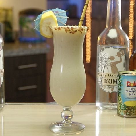 Lovers of slushy, boozy coconut drinks will freak over this Cocobanana cocktail. This tropical, fruity rum-based cocktail mixes up white rum, creme de banana, Amaretto, coconut rum, pineapple juice, cream of coconut, vanilla ice cream, and bananas for a drink that tastes like an island vacation in your mouth. Garnish with toasted coconut flakes, banana slices, and an umbrella to max out those chill island vibes. Key Lime Colada, Rum Desserts, Coconut Cocktails, Sweet Drinks Recipes, Banana Cocktails, Culture Recipes, Coconut Milkshake, Slushy Drinks, Ice Cream Cocktails