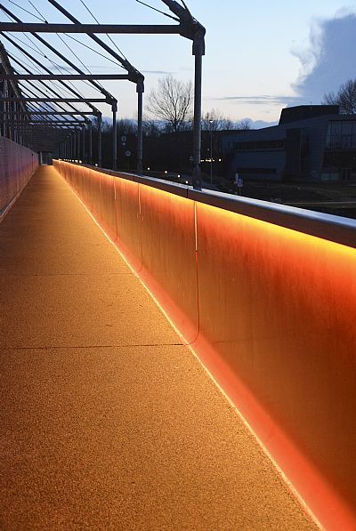 Kulturbro Aalborg (Culture Bridge) by C.F. Møller Architects – a cycle and pedestrian connection piggybacking on an existing railroad bridge. Urban Lighting Design, Bridge Lighting, Glass Railing Deck, Handrail Lighting, Portland House, Hotel Facade, Landscape Lighting Design, Architectural Lighting Design, Railroad Bridge