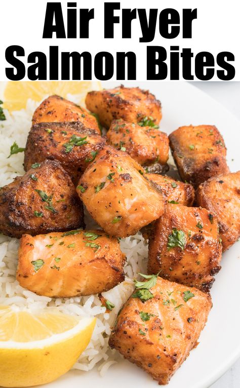 A white dinner plate with 1" cubed salmon bites, white rice, and lemon slices. Text at the top reads "air fryer salmon bites". Salmon Nuggets Air Fryer, Salmon Nuggets, Air Fryer Salmon, Salmon Bites, Frozen Salmon, Delicious Seafood Recipes, Garlic Cream Sauce, Drink Inspiration, Salmon Seasoning