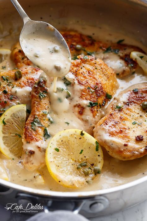 The ultimate in gourmet comfort food with parmesan cheese, garlic and a creamy lemon sauce, this Creamy Lemon Parmesan Chicken Piccata is out of this world. With NO heavy cream! | http://cafedelites.com Creamy Lemon Parmesan Chicken, Lemon Parmesan Chicken, No Heavy Cream, Chicken In Oven, Creamy Lemon Sauce, Chicken Entrees, Chicken Piccata, Parmesan Chicken, Lemon Sauce