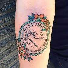 Dinosaur Eats Man Woman Inherits Earth Tattoo, Simple Jurassic Park Tattoo, Feminine Dinosaur Tattoo, Little Foot Tattoos Land Before Time, Jurassic Park Tattoo Ideas, Disney Traditional Tattoo, Traditional Dinosaur Tattoo, Jurassic Park Tattoos, Jurrasic Park Tattoo