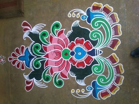 Who doesn't love drawing Rangoli and then staring at their masterpiece every ten minutes? Rangoli is a type of art form of its own. Diwali brings us a major reason to find designs and draw different Rangolis and make our house entrances beautiful with colors. Hopefully, these beautiful ideas will help you in choosing your design. Perfect and Simple Rangoli Designs for Home! New Rangoli, Indian Rangoli Designs, Simple Rangoli Designs, Latest Rangoli, Rangoli Side Designs, Rangoli Colours, Rangoli Designs Latest, Simple Rangoli Designs Images, Muggulu Design