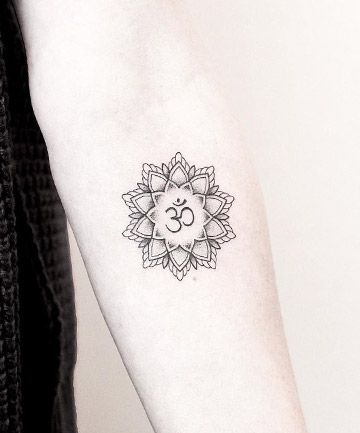 17 Mandala Tattoo Designs to Help Channel Your Inner Warrior Princess Mandala Om Tattoo, Om Tattoo Designs, Mandala Arm, Mandala Arm Tattoo, Ohm Tattoo, Tattoo Designs Mandala, Om Symbol Tattoo, Mandala Arm Tattoos, Mandala Tattoo Meaning