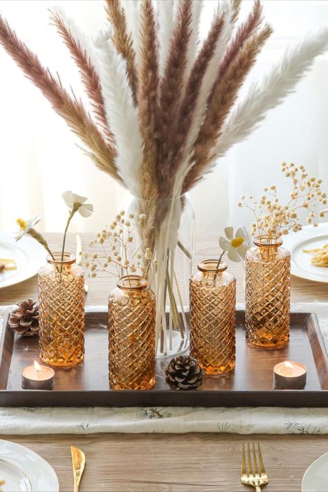 Amber glass flower vases add a touch of vintage elegance to floral arrangements, casting a warm and inviting glow that enhances the natural beauty of any bouquet. This post contains an affiliate link which adds no cost to you. Tiny Bouquet, Vases For Centerpieces, Table Decorations Wedding, Glass Bud Vases, Small Glass Vases, Clear Vases, Mini Flowers, Decor Vase, Exquisite Decor