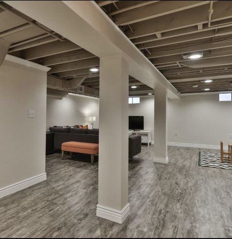 Basement With Poles In Middle, Finished Basement Open Ceiling, Gray Basement Ceiling, Basement Ceiling Paint Colors, Basement Columns, Basement Lights, Low Basement, Basement Floor Ideas, Ceilings Ideas