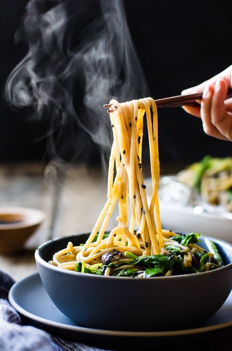 Hot and steamy rice noodles get loads of flavor from ginger, garlic, tamari, toasted sesame oil, and lots of green vegetables in this gluten-free, vegetarian and vegan recipe. This week has been full of excitement. First, I got to test a Mark Bittman recipe and style a shoot for the New York Times. My friend … Continue reading Hot Sesame Rice Noodles with Asparagus, Shiitakes and Pea Shoots Sesame Rice Noodles, Sesame Rice, Bojon Gourmet, Pea Shoots, Plating Ideas, Asparagus And Mushrooms, Mapo Tofu, Pasta Bar, Pasta Fatta In Casa