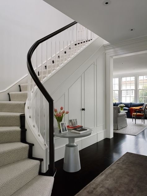 Elegant curved staircase with lucite balusters and polished wood handrail | Classic modern elegance Closet Under Stairs, Transitional Staircase, Staircase Storage, Transitional Furniture, Modern Contemporary Homes, Stair Case, Curved Staircase, Stair Storage, Transitional Living Rooms