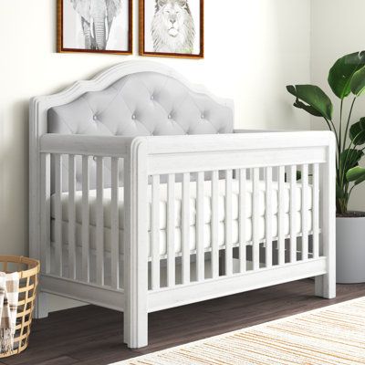 This 5-in-1 convertible crib brings a classic, antique-inspired look to your child's nursery with traditionally layered moldings, an upholstered headboard with button tufting, and an open slat design. It also features an arched keystone headboard silhouette for a luxe look we love. Made from solid wood, it comes in a neutral finish that matches various styles and color schemes. Built to grow alongside your little one, it converts from a crib to a toddler bed, to a daybed, and then to a twin- or Upholstered Crib, Twin Nursery, Nursery Idea, Nursery Room Inspiration, Adjustable Mattress, Convertible Crib, Full Size Bed, Baby Crib, Antique Inspiration