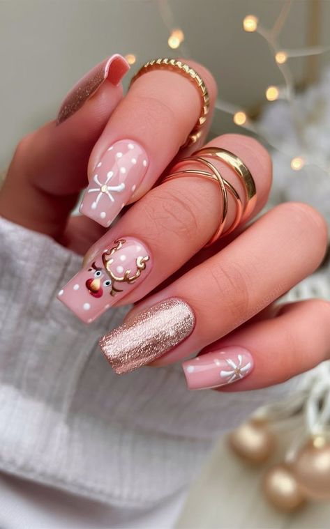 Get into the holiday spirit with these adorable pink nails featuring a playful reindeer, snowflake bows, and shimmering rose gold glitter. The soft pastel shades combined with metallic accents make this design cute and festive for the Christmas season. Glitter Christmas Nails, Pink Christmas Nail, Simple Christmas Nails, Pink Reindeer, Christmas Nail Ideas, Marble Nail Designs, Manicure Nail Designs, Rose Gold Christmas, Christmas Nails Easy