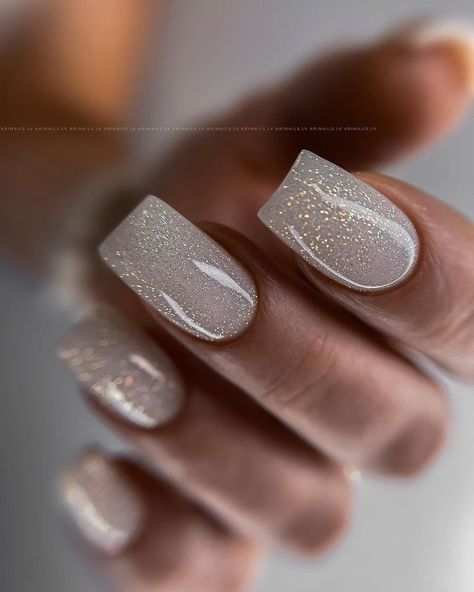 19 Gorgeous Winter Gel Nail Colors for 2023-2024 - thepinkgoose.com Silver Nails Sns, Christmas Party Nails Sparkle, Nye Nails Dip, Chrome Sparkle Nails, Nye Nails 2022, Winter Gel Nail Colors, Neutral Colored Nails, Nye Nails Short, Winter Nails Square