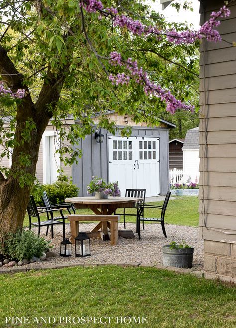 Our Cottage inspired back patio! Pine And Prospect Home, Pine And Prospect, Pea Gravel Patio, Shed Makeover, Gravel Patio, Lamp Makeover, Pea Gravel, English Cottage Style, Outdoor Diy Projects