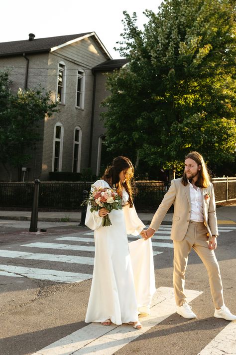 A bride and groom walk across a crosswalk in downtown Nashville at the Cordelle. The Cordelle Nashville, Wedding Photographer Packages, The Cordelle, Fall Wedding Photos, Nashville Wedding Venues, City Engagement Photos, Wedding Photography Packages, Ceremony Arch, Groom Photo