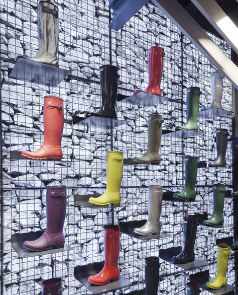 Gabion wall displaying iconic Hunter Wellington boot Gabion Stone, Retail Architecture, Gabion Wall, Creative Shop, Retail Inspiration, London Trip, Retail Windows, Design Blogs, Retail Merchandising