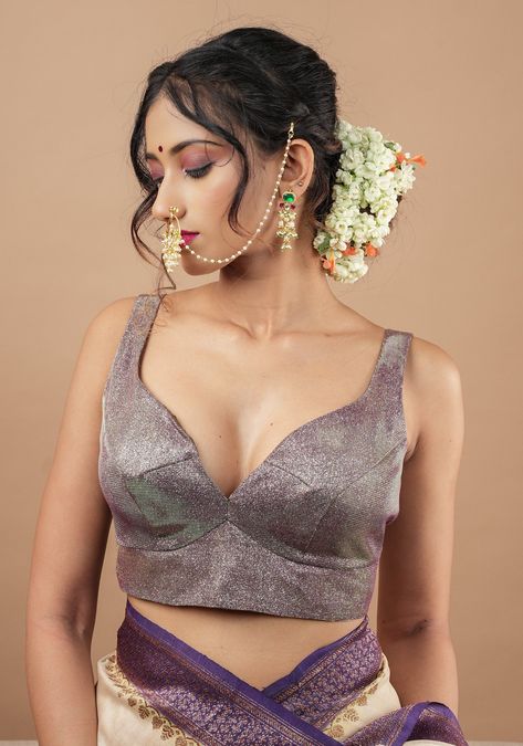 A stylish blouse set in an Amethyst purple and green mix. With a silvery shimmer, stylish silhouette with a sweatheart neck in the front and tumbler neckline in the back and a versatile mix and match color, this blouse makes a great pairing for many of your sarees! Need minor customizations? Ask us and we will try our best to make it happen! SIZE GUIDE : To determine your blouse size, please measure around the fullest part of your bust line using a measuring tape. Your bust measurement will corr Whatsapp Widget, Sequin Saree Blouse, Sequin Saree, Backless Blouse, Stylish Blouse, Readymade Blouse, Amethyst Purple, Purple And Green, Measuring Tape