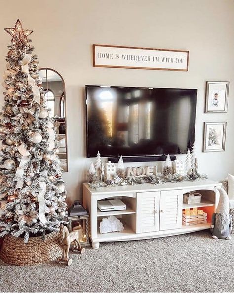 20 Christmas TV Stand Styling Ideas » Lady Decluttered Christmas Decoration Tv Stand, Christmas Tv Stand Decor Ideas, Tv Cabinet Christmas Decorations, Christmas Under Tv Decor, Above Tv Christmas Decor, Christmas Garland Tv Stand, Tv Console Decorating Christmas, Christmas Decor Ideas For Tv Stand, Christmas Decor Tv Console