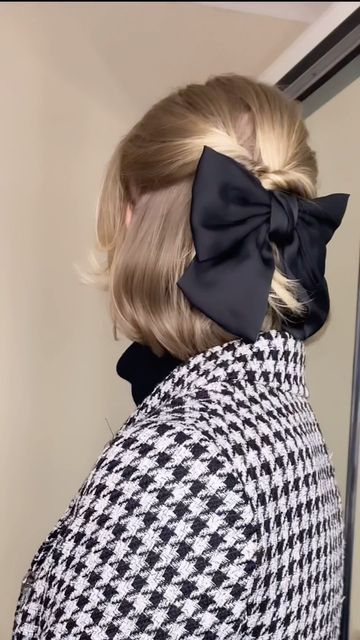 IRAYNE HODGSON • STYLE & BEAUTY on Instagram: "The easiest, quickest bob hairstyle! 🎀🎀🎀 Even a novice can do this hair style - it’s really simple but looks so elegant. It doesn’t have to be perfect, which is why it’s good to have a kink or curl in your hair first! Top tip: loop the hair through so that it lays flat for the bow to sit nice and flush against your head! My bow is @primark #shorthair #shorthairstyles #halfuphalfdown #bob #bobhairstyles #bobcut #bow" Bob Bow Hairstyle, Big Bow Short Hair, Bow In Short Hair, Short Hair With Bow, Easy Wedding Guest Updo, Wedding Guest Updo, Curled Bob, Natural Hair Short Cuts, Easy Wedding