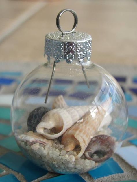 #DIYchristmas #DIYcrafts #beach #nautical #Christmas #holidays - Make your own stunning nautical beach inspired Christmas ornaments by filling glass ornament balls with sand, tiny seashells, beach glass, raffia, tiny stones and nautical-inspired rope! Nautical Christmas Ornaments, Seashell Christmas Ornaments, Beach Christmas Ornaments, Deco Marine, Shells And Sand, Coastal Christmas Decor, Nautical Christmas, Beachy Christmas, Beach Ornaments